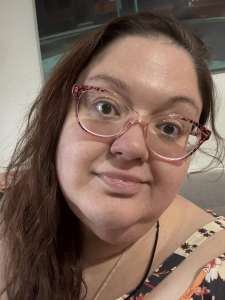 This is a personal selfie of myself wearing a half smile, half smirk.
