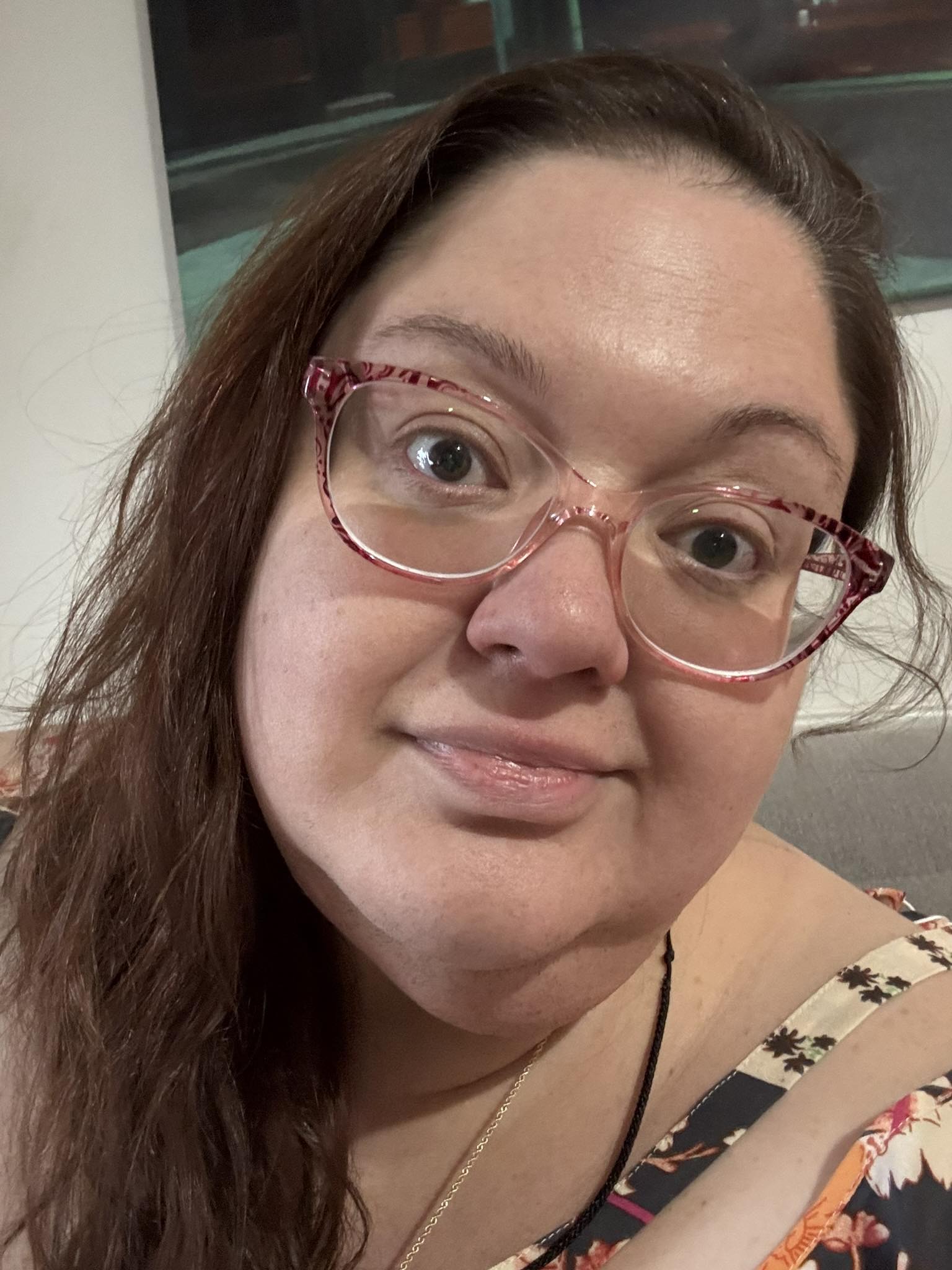 This is a personal selfie of myself wearing a half smile, half smirk.